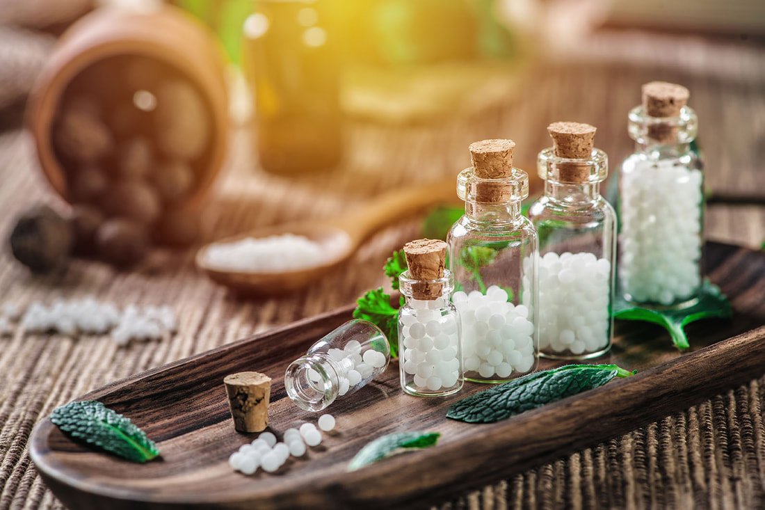 Natural homeopathic remedies with herbs and mortar - FirstCare Homeos holistic healing